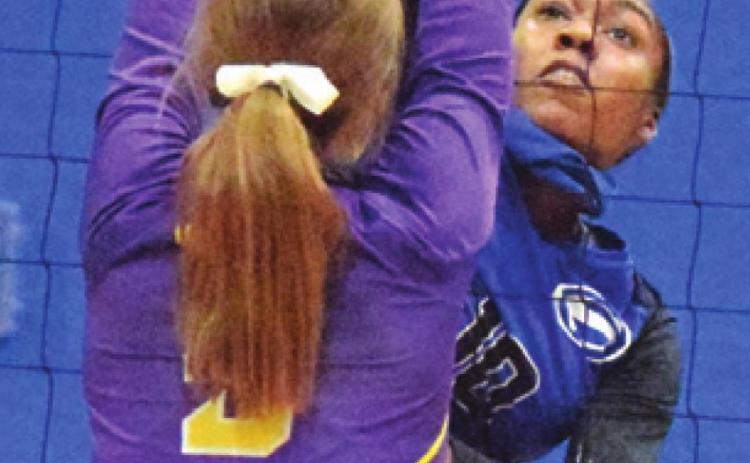 JAIVAN STRINGFELLOW gets one of her seven kills against Weimar at the Snook Gym on Friday. -- Tribune photo by Denise Hornaday