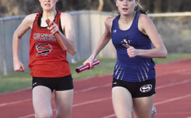 DAKOTA KIENOW closes in on the finish line during a relay at the Koppers Relays back in March. Kienow qualified for the state track meet in the girls triple jump.