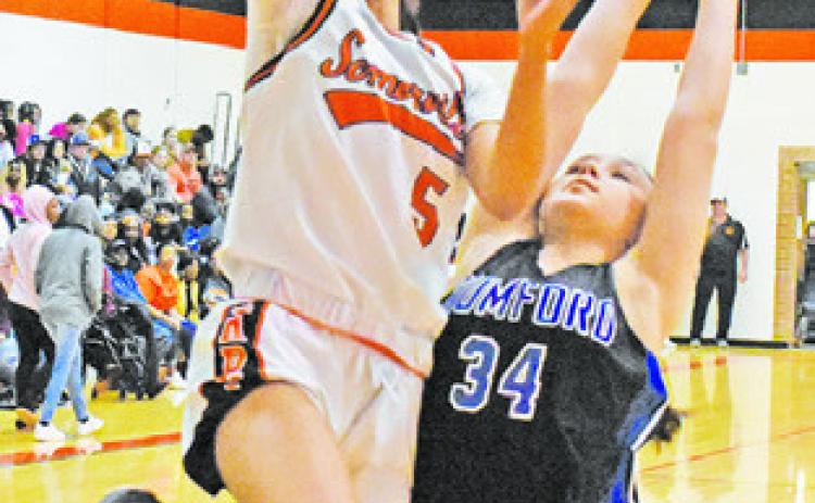 DESTINY VELA reaches for a layup during the Somerville-Mumford game last Friday night.