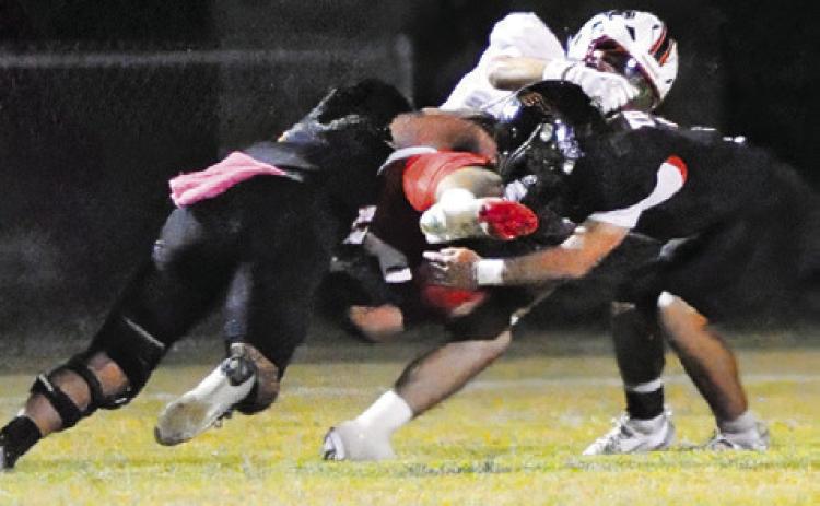 SOMERVILLE’S MARTIN ESPINOZA and Jayden Young make a tackle make a tackle against Burton in the homecoming game. Tribune photo by Denise Squier