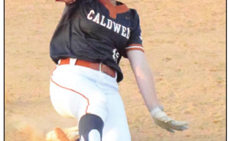 KELLY URBANOVSKY slides safely into third base during Caldwell’s win over Cameron Yoe last Monday. -- Tribune photo by Denise Squier