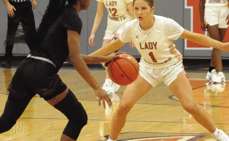 CALDWELL’S LYDIA HICKS defends during Caldwell’s 4431 win over Hearne last Tuesday night in Hornet Gym. Tribune photo by Denise Squier