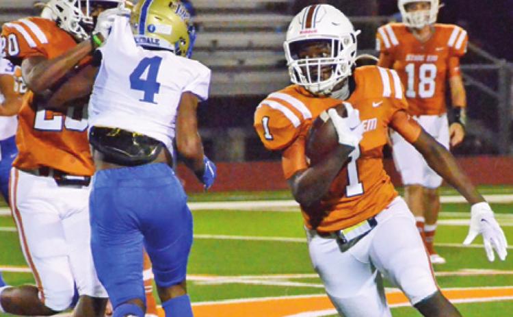 JAMAR HEWITT CARRIES the ball on Friday against Rockdale.