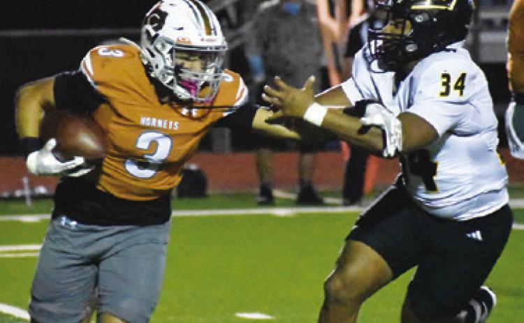 COY BECKA OF Caldwell breaks away from this Sealy defender. Tribune photo by Roy Sanders