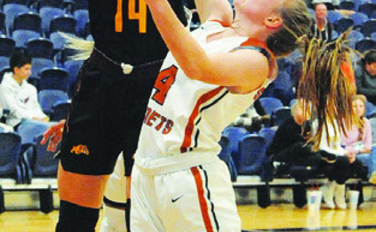 CADIE COSTON fights for a rebound during the Lady Hornets’ home game Friday against Thorndale. -- Tribune photo by Denise Squier