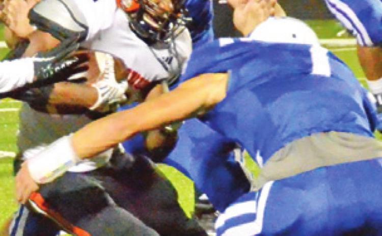 SOMERVILLE’S VERKOBE Woodberry carries the ball as Snook’s Garrett Lero makes a tackle. -- Tribune photo by Miranda Jones