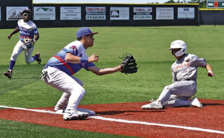 KORBIN BURNS SLIDES safe into third base in the Brookshire Royal game. Tribune photo by Roy Sanders