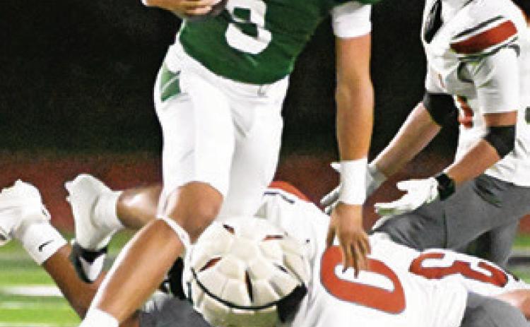 ROGELIO HERNANDEZ dives for a tackle last Friday against Franklin. Tribune photo by Denise Squier