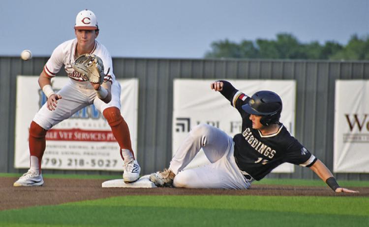 RYAN SEE GETS READY to catch the ball at second base against Giddings. The Hornets won 7-2 to clinch at least a share of the district title. -- Tribune photo by Roy Sanders