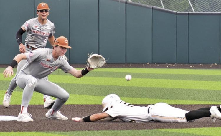 SHORTSTOP RYAN SEE gets ready to catch this ball and tag the Gatesville base runner out in the Thursday game in Waco. -- Tribune photo by Roy Sanders