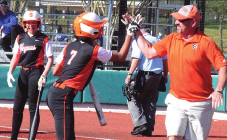 SOMERVILLE’S RA’MAYA Carter celebrates with head coach Cal Neatherlin after Carter hits an in-the-park home run against Navasota at the Franklin Tournament. -- Tribune photo by Denise Hornaday
