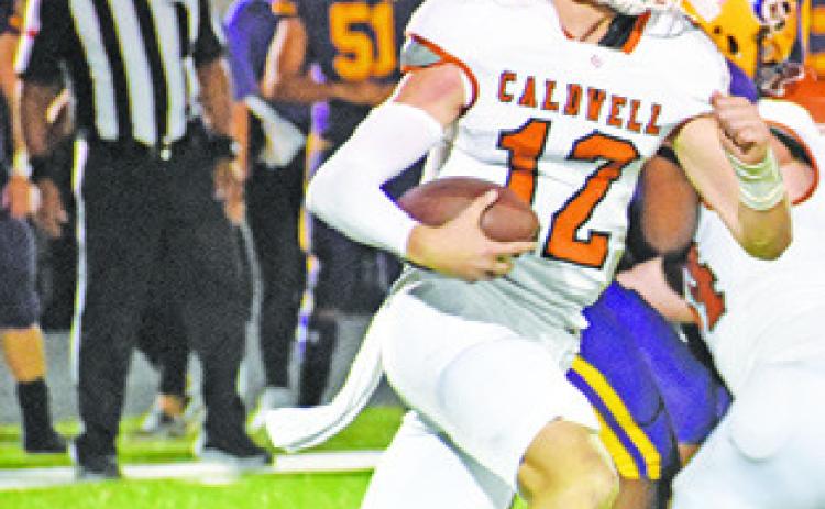 BOONE TURNER of Caldwell carries the ball for Caldwell against La Grange prior to his injury. -- Tribune photo by Roy Sanders