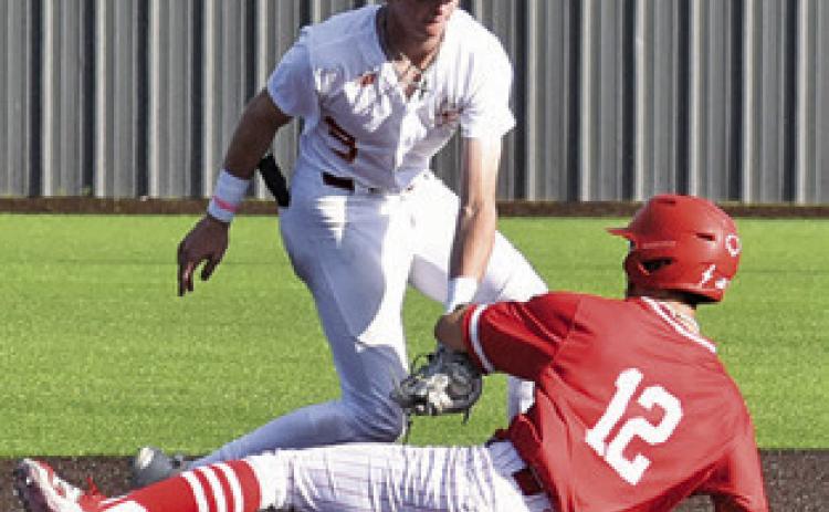 RYAN SEE of Caldwell tags this Salado base runner in the round two playoff game. Tribune photo by Roy Sanders