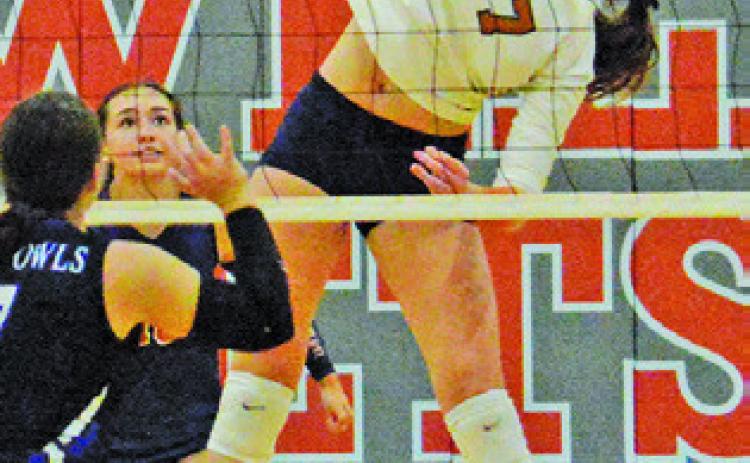 LYDIA GIESE stretches to keep the ball in play, hitting it over the net during Caldwell’s win over Anderson-Shiro on Friday. Tribune photo by Kimberly Hutcheson